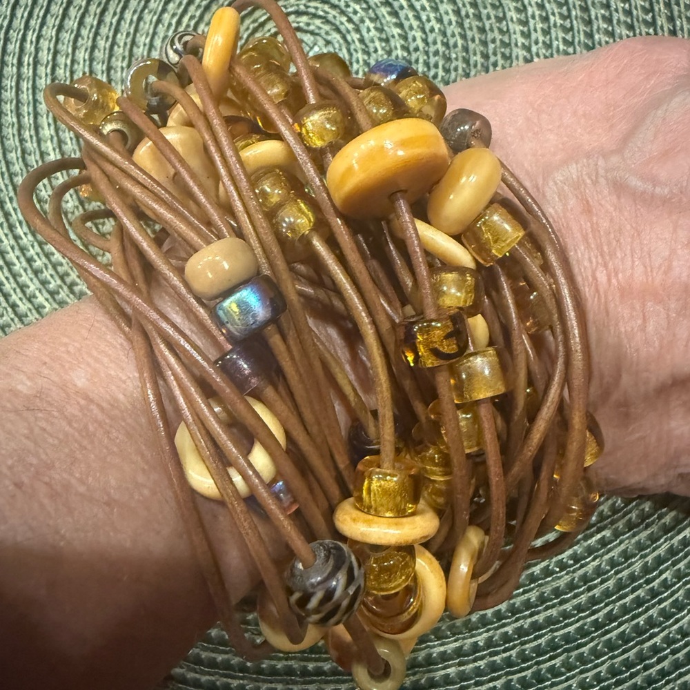 Handcrafted brown and gold beaded leather multi-strand Artisan bracelet